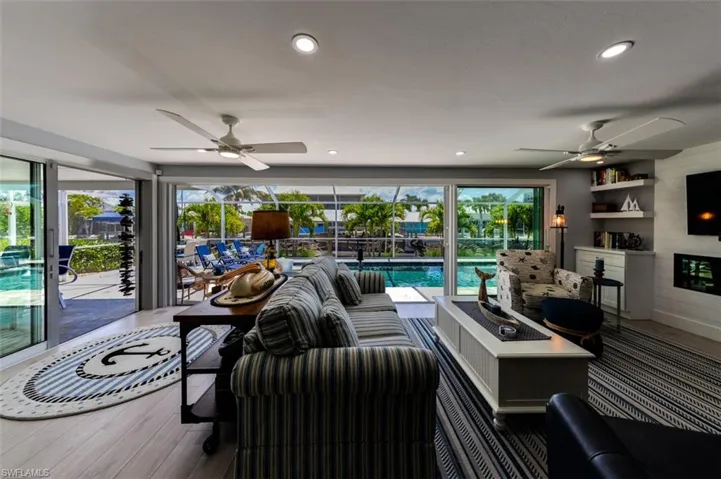 Living room featuring plenty of natural light, and ceiling fan