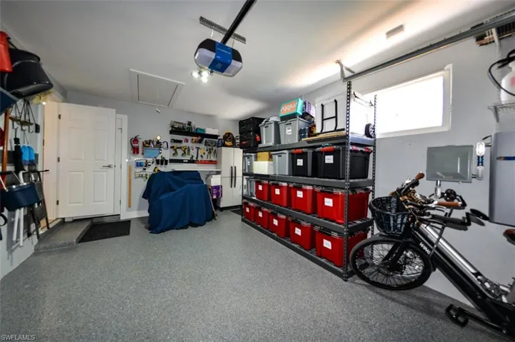 Garage featuring a garage door opener