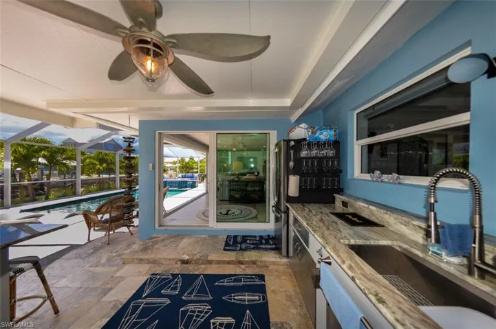 View from outdoor kitchen towards living room