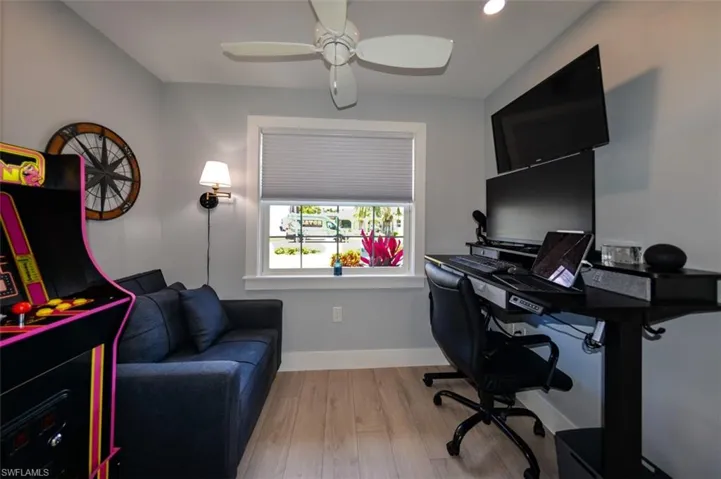 Office space/bedroom with ceiling fan