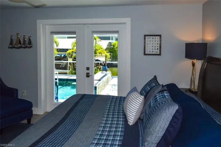 Bedroom with access to exterior and french doors