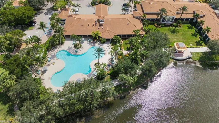 Drone / aerial view of a pool and a large body of water