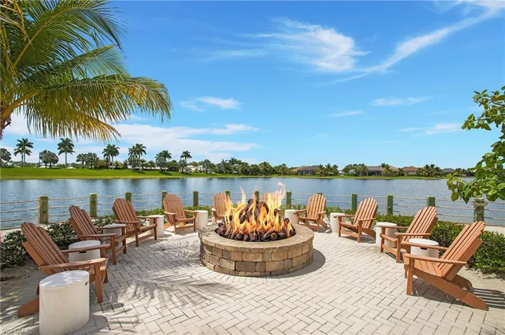 View of patio / terrace with a water view and an outdoor fire pit