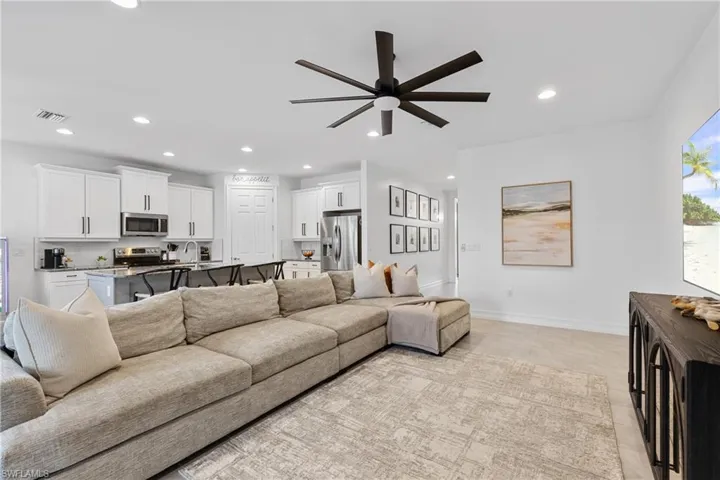 Living room featuring ceiling fan
