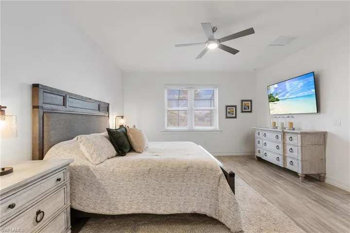 Bedroom featuring light hardwood / wood-style flooring and ceiling fan
