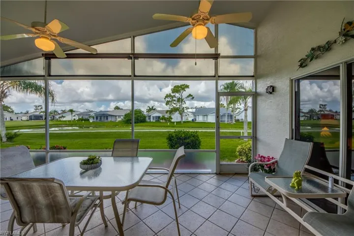 Lanai Overlooks 12th Ladies Tee and Water Feature along the back of the home.  It boasts a tile floor and sun shades as well as NEW HURRICANE ACCORDION SHUTTERS IN 2023 or 2024.