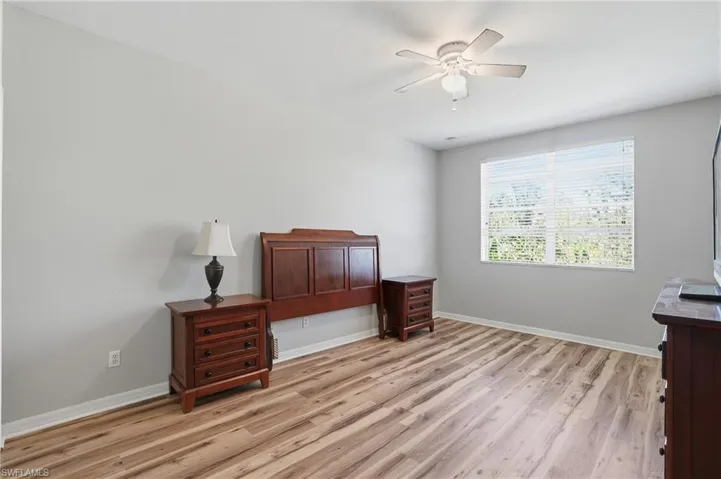 Bedroom featuring light wood-style floors and ceiling fan