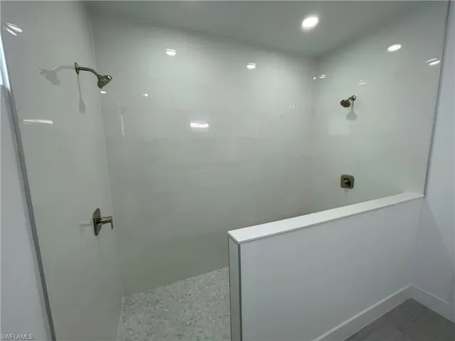 Full bath with a walk in shower and recessed lighting