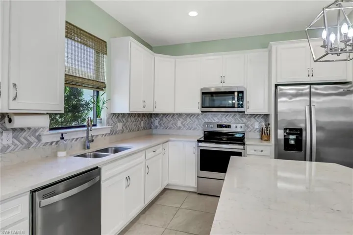 Kitchen featuring appliances with stainless steel finishes