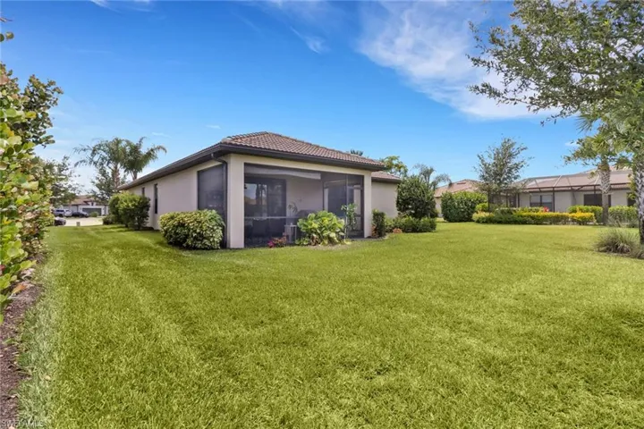 View of yard with a sunroom