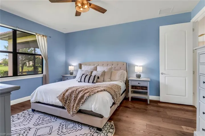 Master bedroom with wood finished floors