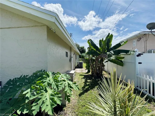 View of side of property featuring central AC unit