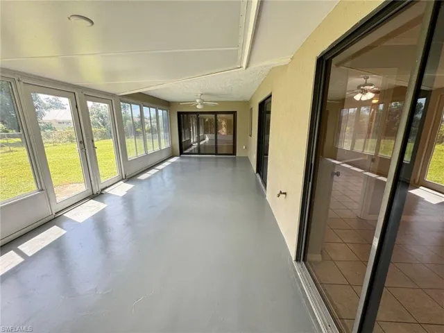 Unfurnished sunroom featuring a healthy amount of sunlight
