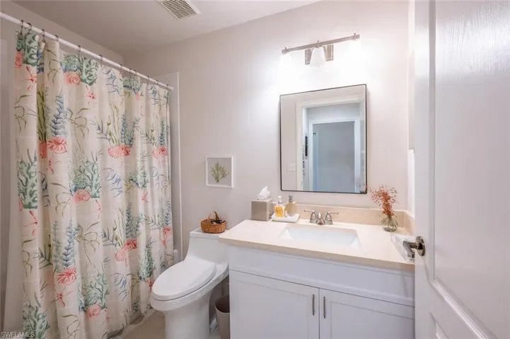 Bathroom with vanity and toilet