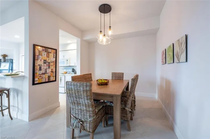 Dining space featuring baseboards and light tile patterned floors