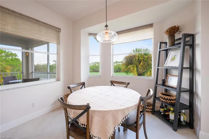 Dining area featuring baseboards and light tile patterned floors