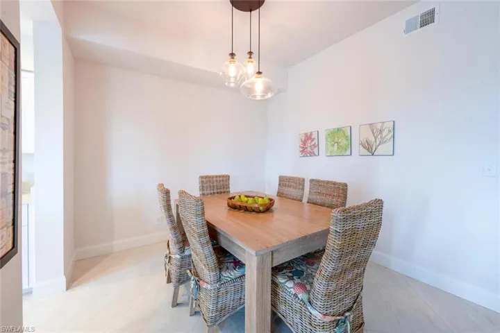 Dining area with baseboards and light tile patterned floors
