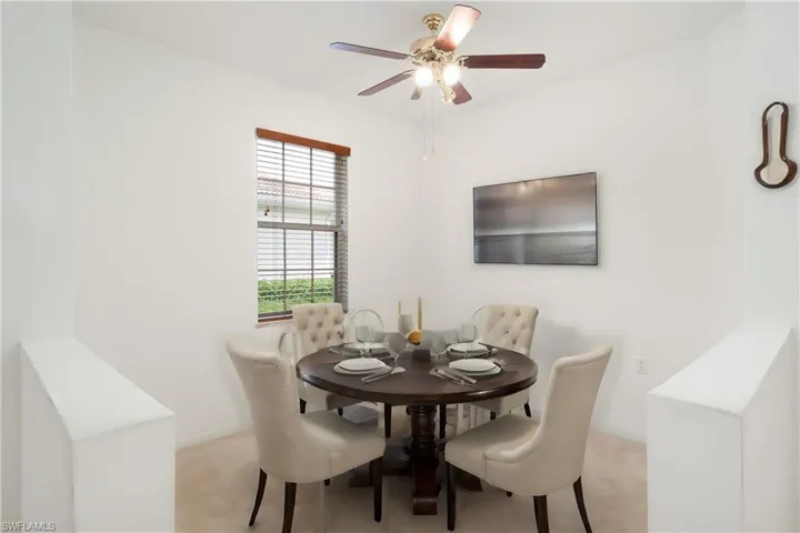 Dining area featuring carpet flooring and ceiling fan
