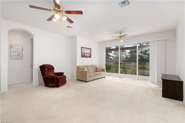 Sitting room with carpet and ceiling fan