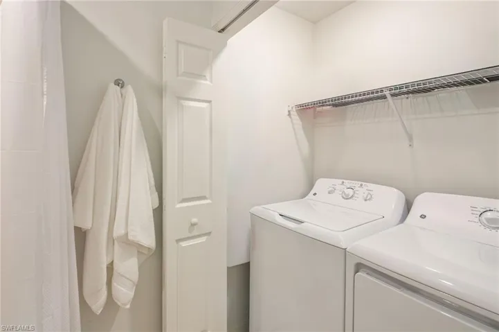 Laundry located inside the guest bath.