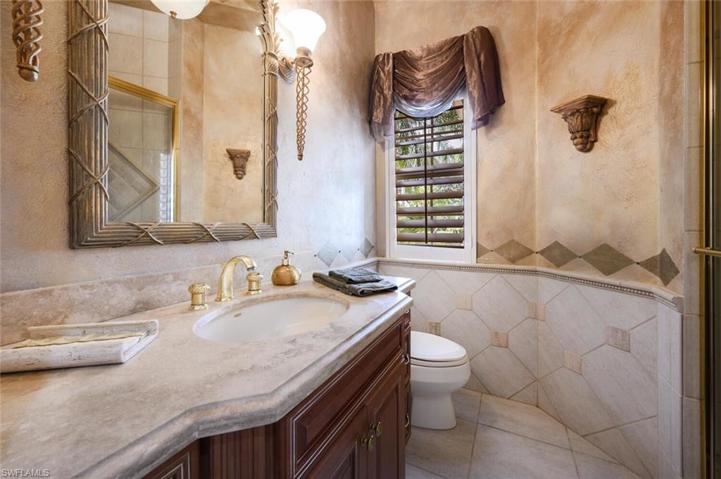 4th guest bathroom with walk in tile shower off of the courtyard