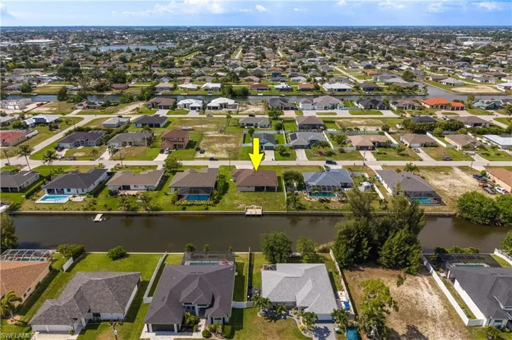 Waterfront property with direct canal access, featuring a private boat dock