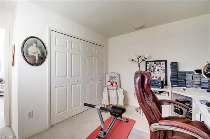 Office featuring light colored carpet