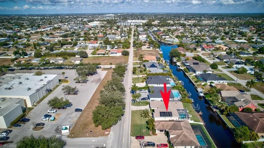Aerial perspective of suburban area with a large body of water