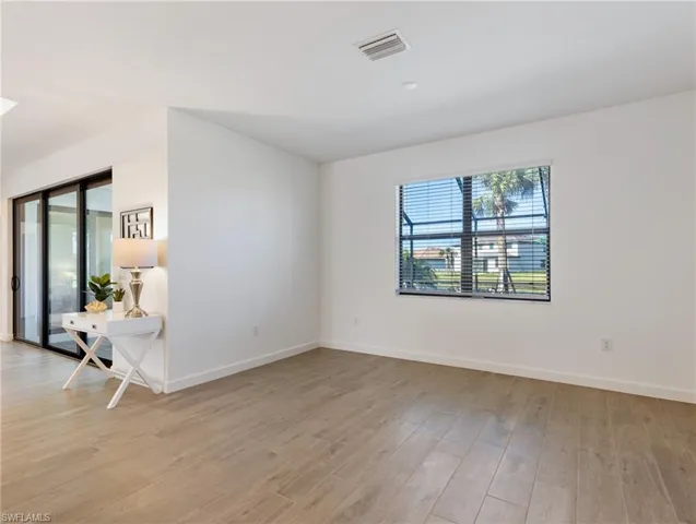 Empty room featuring light wood-type flooring