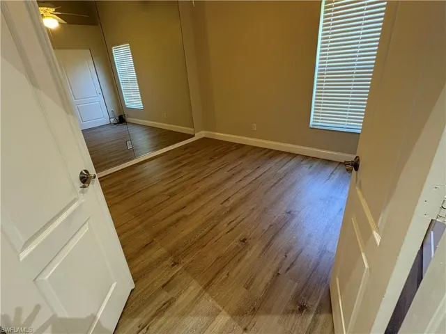 Empty room with light wood-style floors