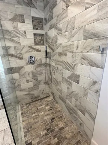 Full bathroom featuring tiled shower