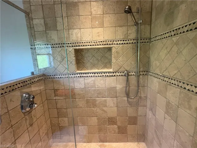 Full bath with tiled shower