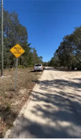 View of road featuring traffic signs