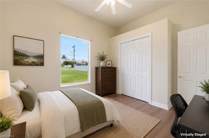 Neutral wall tones with wood-finish flooring