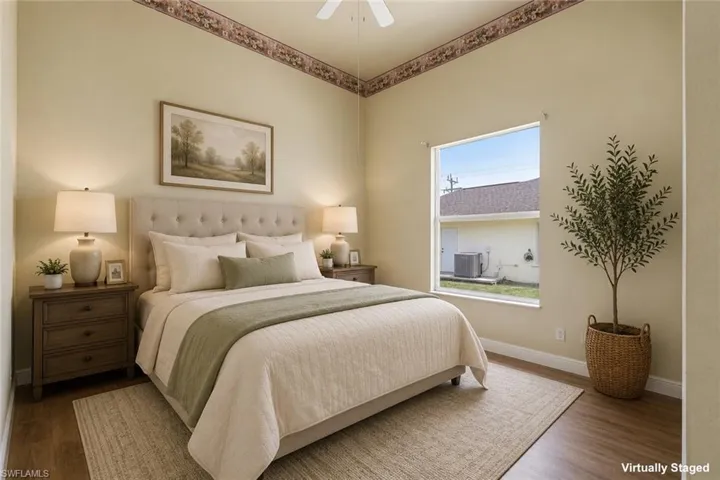 Bedroom featuring wood-finish flooring, a contemporary window, and a ceiling fan