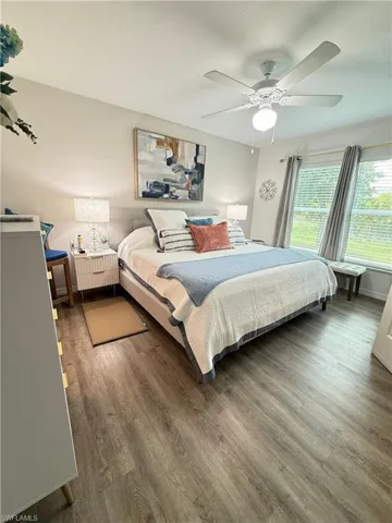 Bedroom featuring wood finished floors and a ceiling fan