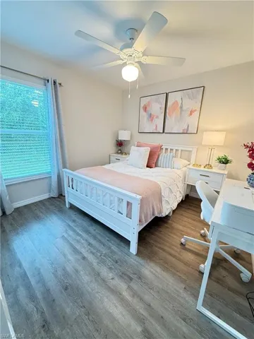 Bedroom featuring wood finished floors and ceiling fan