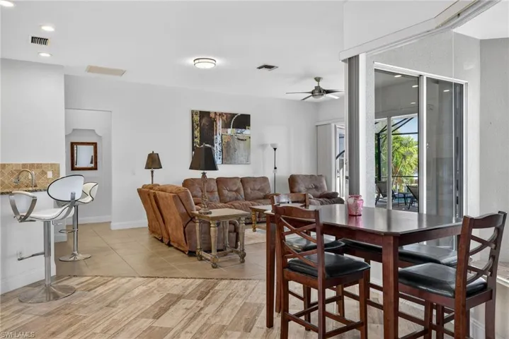 Dining space featuring a ceiling fan, light wood-style flooring, and recessed lighting