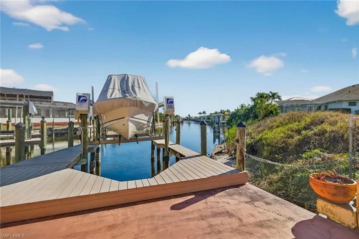 Dock with a water view and boat lift