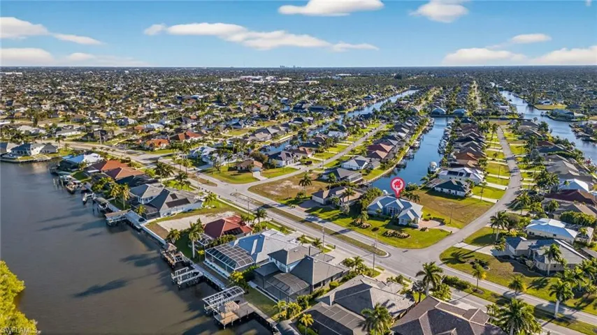 View of property location with nearby suburban area and a large body of water