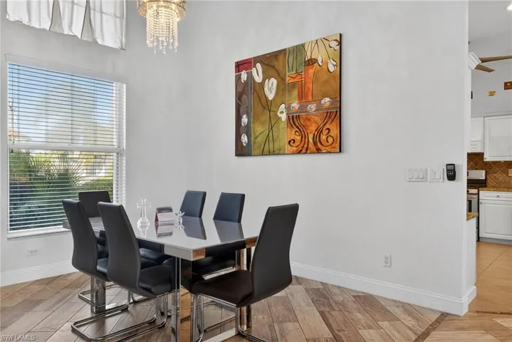 Dining area with a chandelier and light wood finished floors