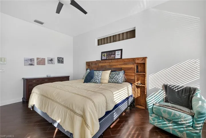 Bedroom with wood finish floors and ceiling fan