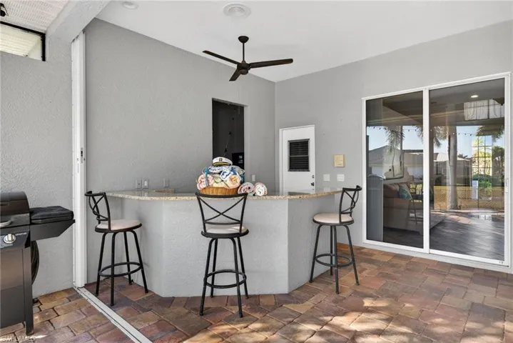 View of patio / terrace featuring ceiling fan and grilling area