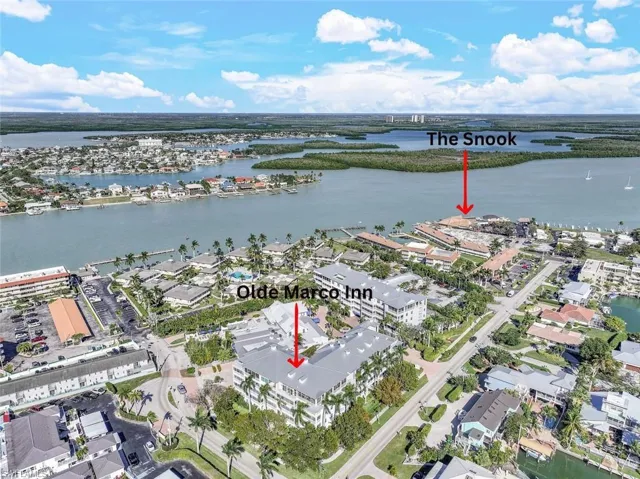 Aerial view of property's location featuring a nearby body of water