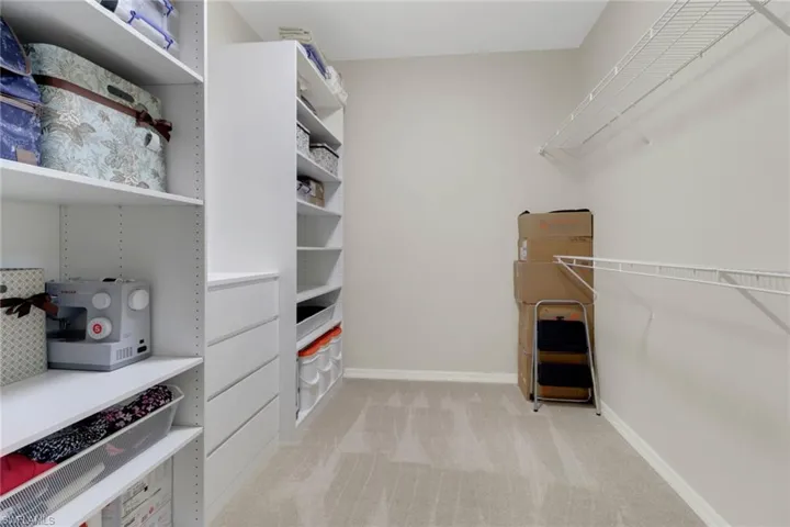 Master closet with custom shelving.