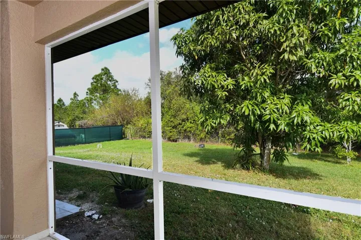 View of yard featuring fence