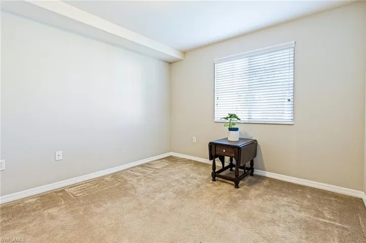 Spare room featuring carpet flooring