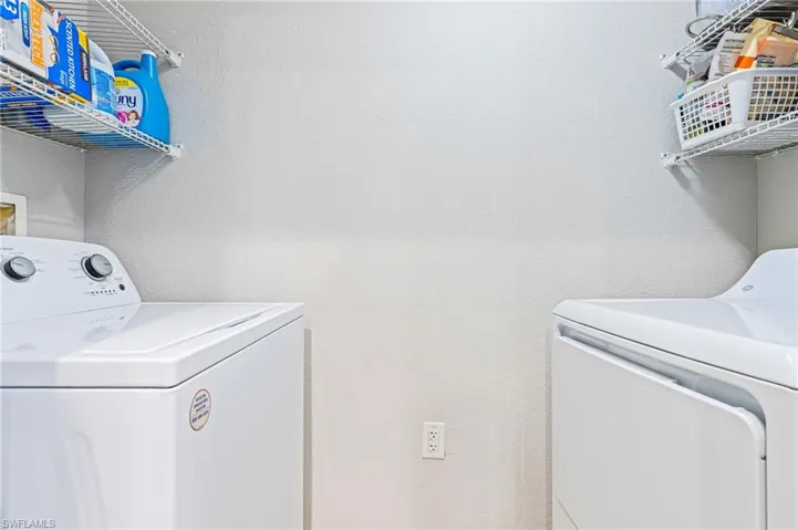 Laundry room featuring washing machine and dryer