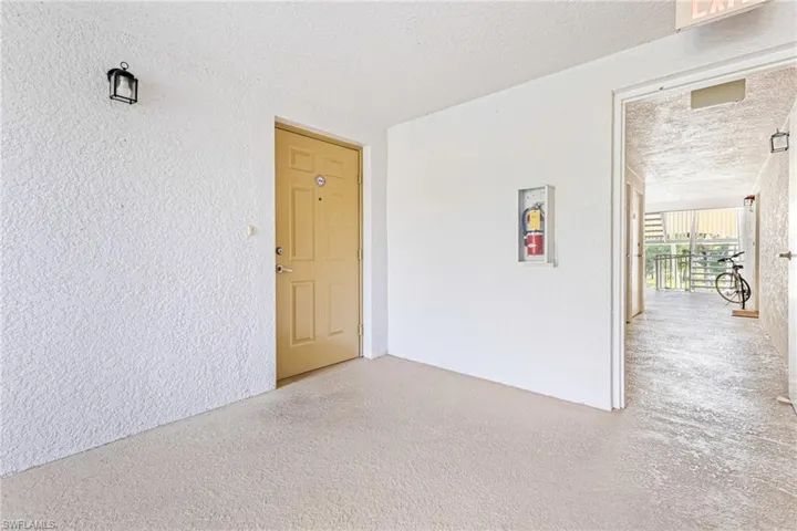 Empty room featuring a textured ceiling
