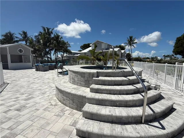 Surrounding community featuring a patio area and an outdoor hangout area